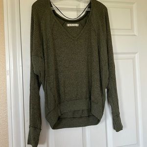 green V-necked free people sweater